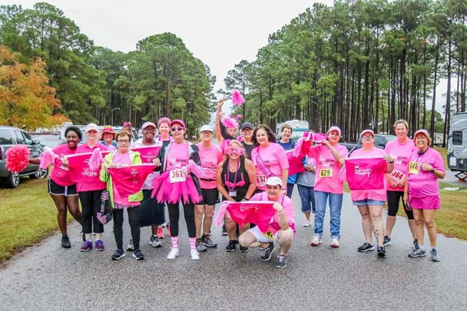People gather to support breast cancer patients with pink color dress at Mobile, AL 