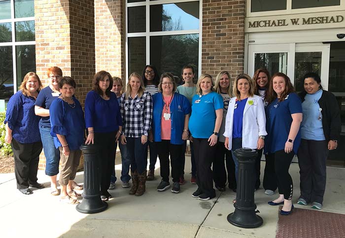 SCC staff dressed in blue