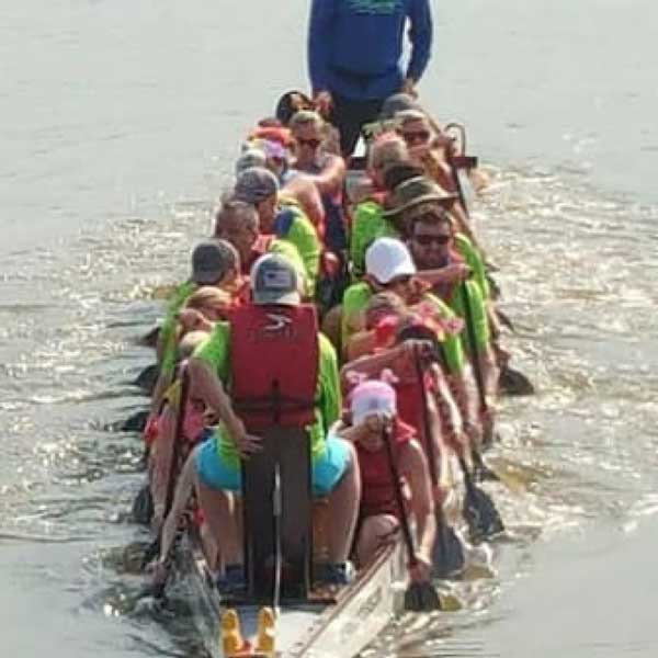 SCC's  team riding boat at the Dragon Boat Festival in Alabama