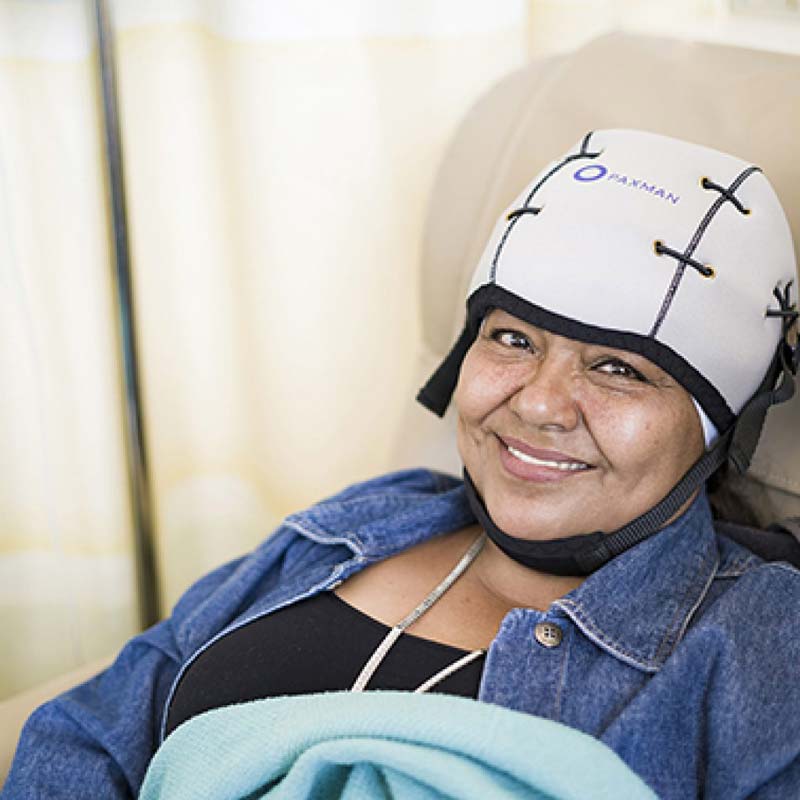 Woman experiencing Paxman Scalp Cooling