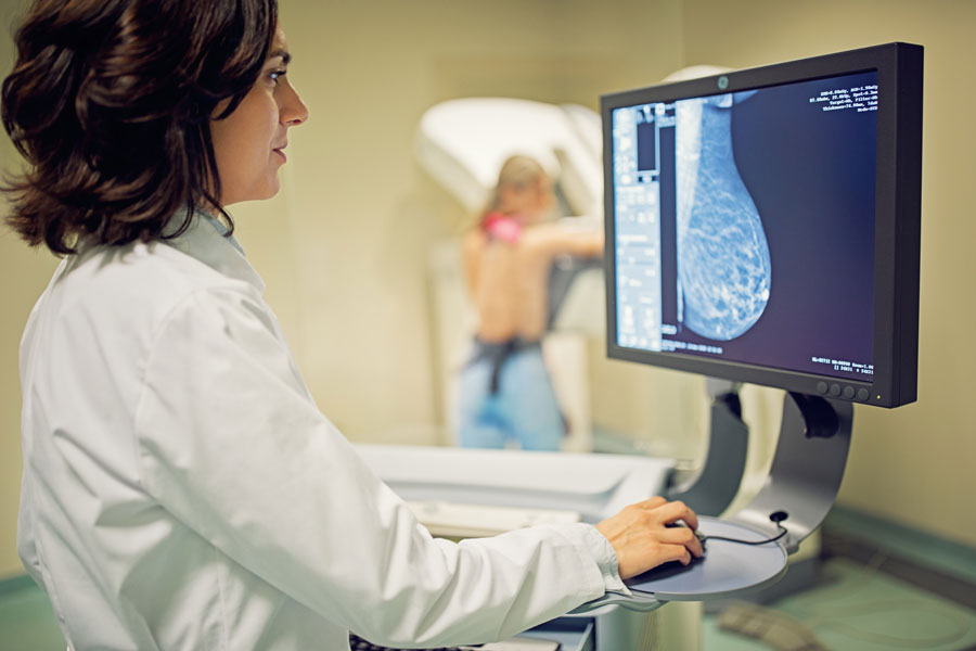 a doctor checking scan results in computer