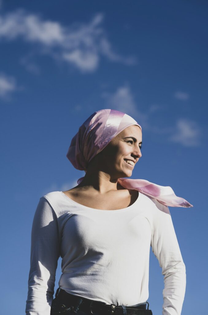 Young beautiful woman with cancer bandana